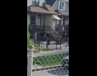 Woman black jacket tiktok dance front yard