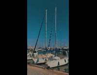 View of docked boats by pier 