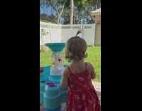 Toddler girl playing outdoors accidentally does a crazy catch