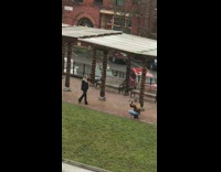 Woman in black formal attire suit models at the park