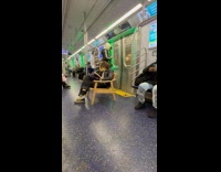 Woman reads book own chair at subway