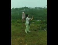 Old woman umbrella wind selfie