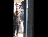 Man standing bench flip off camera