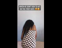 Girl wearing checkered dress dances in circle 