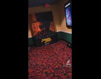 Indiana jones poster runs at guy movie theater 