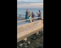 Long green ballgown dress girl tiara beach  