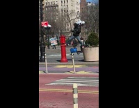Guy standing spread leg dancing while guy makes lgbtq speech