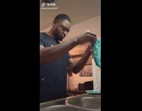 Guy doing dishes hears thud in sink 