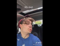 Blue nike shirt guy back of car