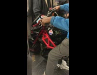 Blue sweater guy black red motorcycle subway