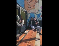 Two guys pose with dog