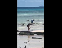 Woman beach bikini takes picture of butt