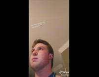 Guy and dad dodge water bottles tied to fan 