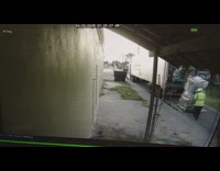 Guy pulls a stack of heavy packages on pallet truck and accidentally tips over entire package