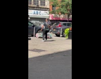 Boy sit on rock while dad dances