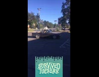Vintage convertible car does donuts parking lot 