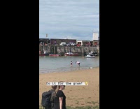 Black bathing suit girl red white boat