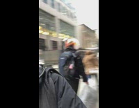 Person wears clear bubble helmet over head