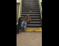 man asleep on stairs rat walks by