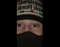 Guy rides blue sled down snow mountain 