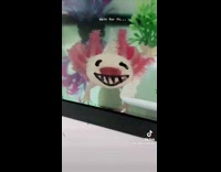Girl draws happy face on axolotl