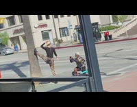 Lady in Leopard Print Poses with Leg on Tree
