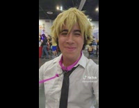 Guy cosplays chainsaw man while on a leash 