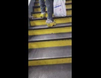 Collab Subway Creatures - Guy walking up stairs wears yellow clogs 