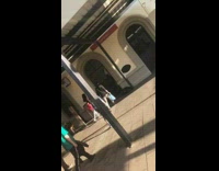 bald man in shorts and back pack 