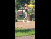 Guy pretends to walk camera tripod park