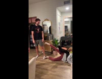 Dog humps leg of woman on floor