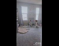 2 baby twin girls spend time together 