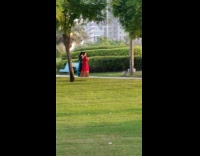 Two women red dress dance tiktok park