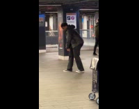 Guy dances to classic song in station