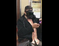 Pink shirt guy black gas mask subway 