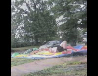 Black Shorts Tries to Jump Over Slide on Glass