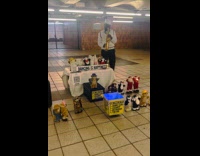 Man plays saxophone with dancing stuffed toys