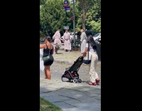 Monks playing hacky sack on street