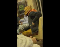 Guy wears brown cloth bag on head