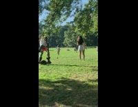 Guy rides hoverboard through park with wings