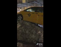Yellow minivan cab parked on ice 
