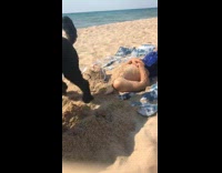 Dog Digs Sand and Splashes it on Asleep Man
