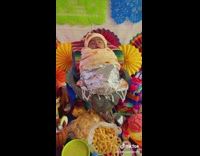 Baby wrapped inside a fake burrito wrap on birthday celebration