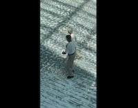 Older couple ice skating in unison together 