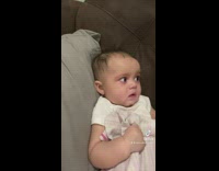 Baby asked to say yeah confused by woman