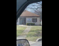 Guy in car reads gooch law office sign 