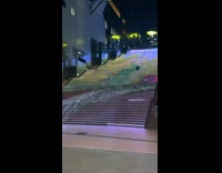 Guy running up colorful light stairs falls 