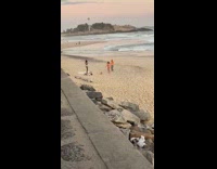 Girl bikini pose with dog on leash beach