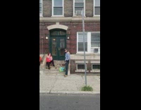 Lizard on shoulder of man on street