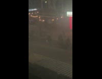 blurry shot of man in street yelling